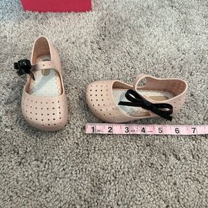 Mini Melissa Mini Furadinha Pink Shoe with Black Bow